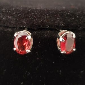 Sterling silver oval red Garnet post earrings.